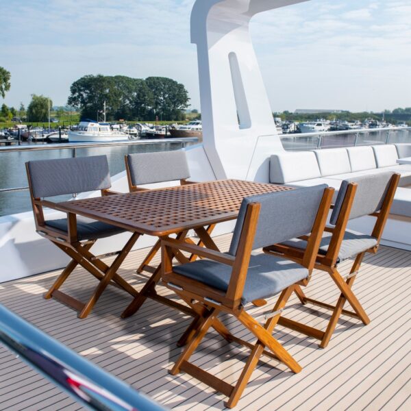 teak table with edge chairs